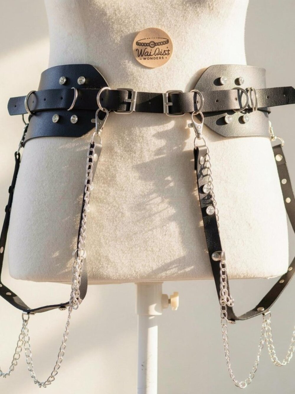 Y2K 2000s style Black leather harness with silver hardware and chain details